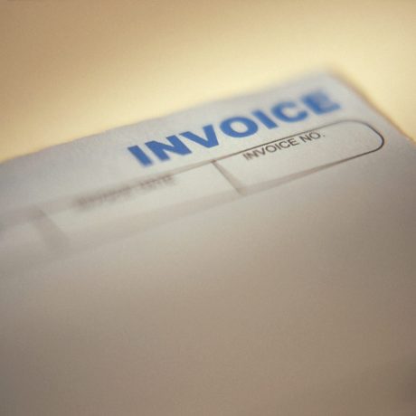 Business invoice. Extremely shallow DOF with focus (and soft spotlight) on the word Invoice.